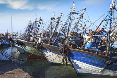Boats moored at harbor