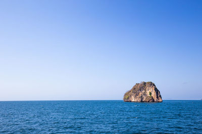 Scenic view of sea against clear blue sky