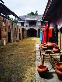 Rear view of people sitting outside building