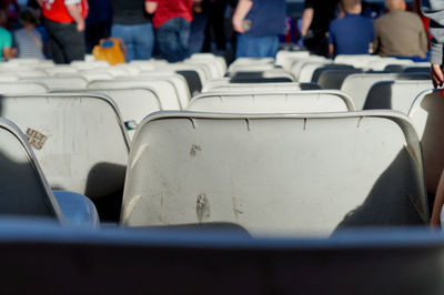 Crowd sitting on chair at stadium