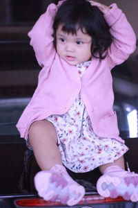 Portrait of cute girl sitting