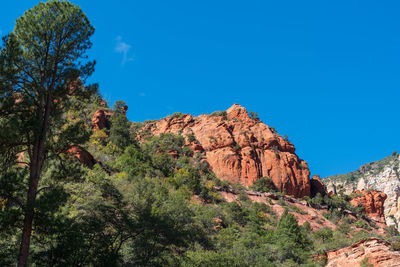 Scenic view of mountains against clear blue sky