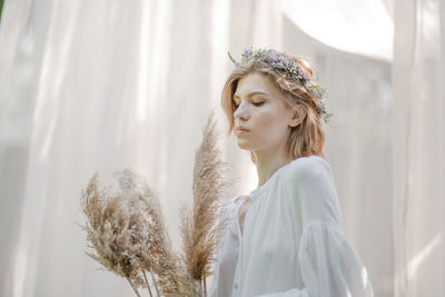 Portrait of young woman looking away