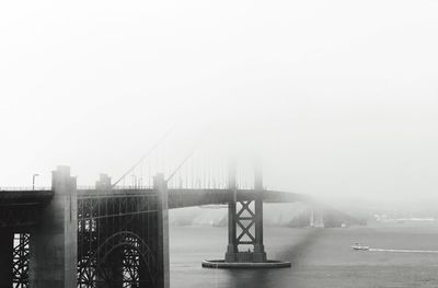 View of suspension bridge in foggy weather