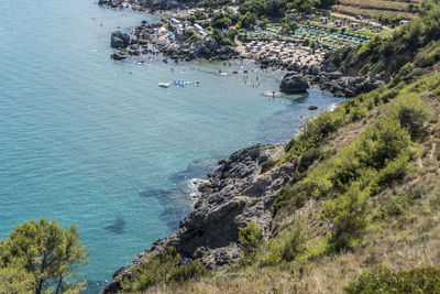 High angle view of rocks by sea