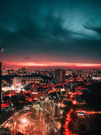 High angle view of illuminated buildings in city at night