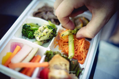 Close-up of hand holding food