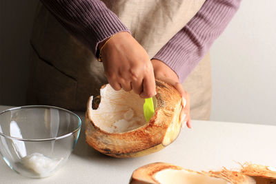 Midsection of man preparing food on table