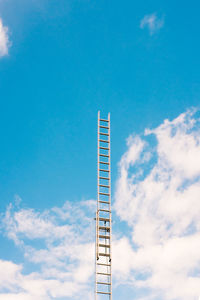 Low angle view of ladder against sky