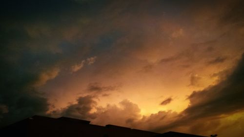 Low angle view of cloudy sky at sunset