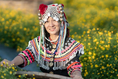 Portrait of smiling girl against plants