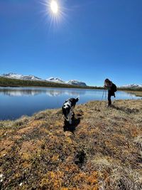 Women and dog on the lake