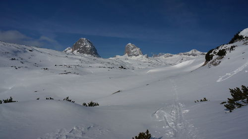 Scenic view of snowcapped mountains against sky