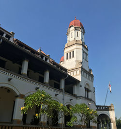 Low angle view of building against clear blue sky