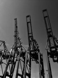 Low angle view of crane against clear sky