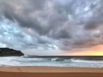 Scenic view of sea against cloudy sky