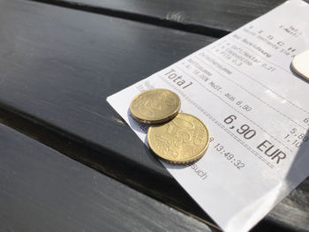 High angle view of coins on table