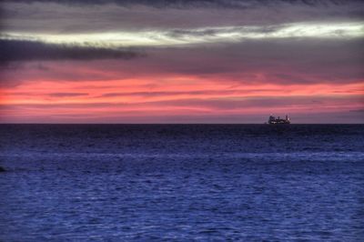 Scenic view of sea against dramatic sky