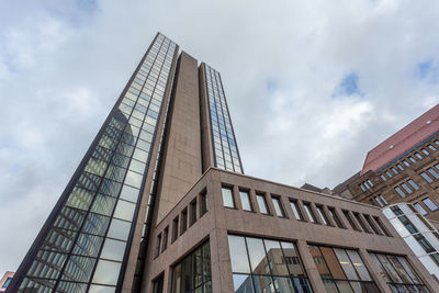 Low angle view of skyscraper against sky