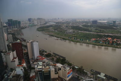 High angle view of river amidst buildings in city