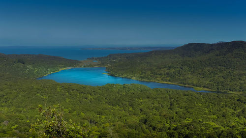 Scenic view of sea against blue sky