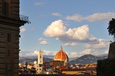 Panoramic view of buildings in city against sky