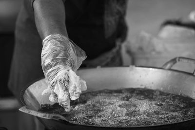 Midsection of person preparing food