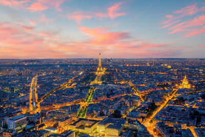 Aerial view of city against sky during sunset