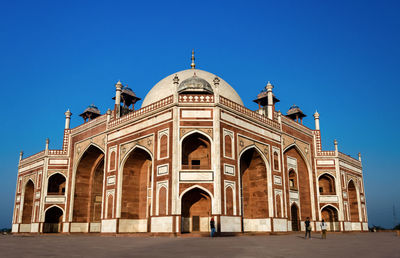 View of historical building against clear blue sky