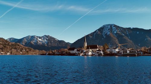 Scenic view of bay against blue sky