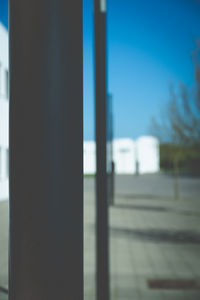 Close-up of metal railing against sky