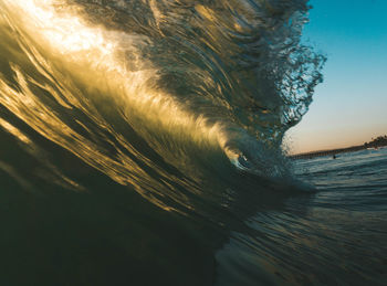 Scenic view of sea against sky at sunset