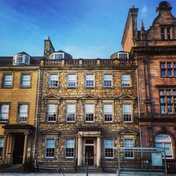 Low angle view of building against blue sky