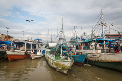 Boats moored at harbor