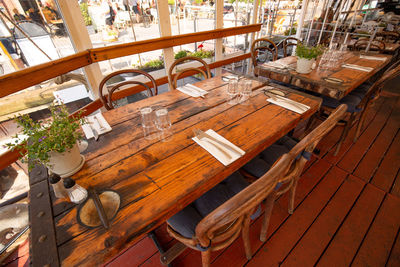 High angle view of empty chairs and table in restaurant