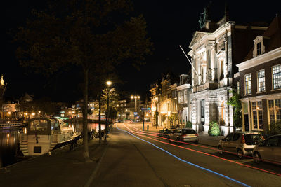 Light trails on road in city at night