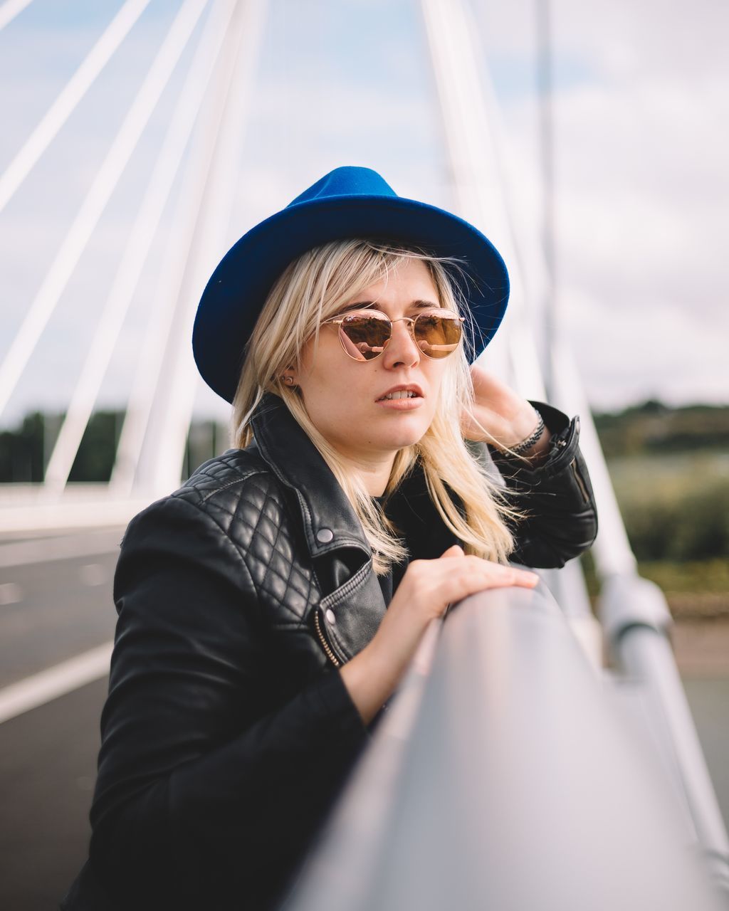 real people, one person, lifestyles, leisure activity, fashion, young women, young adult, sunglasses, blond hair, hair, glasses, women, adult, day, portrait, focus on foreground, casual clothing, clothing, hairstyle, beautiful woman, outdoors