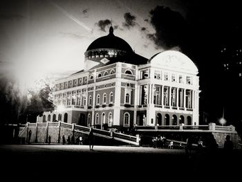 Building in city against cloudy sky