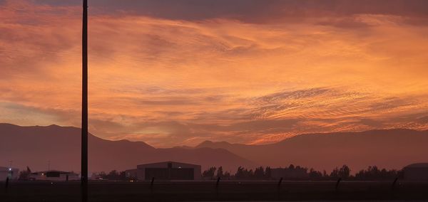 Scenic view of dramatic sky during sunset