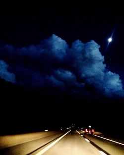 Road against sky at night