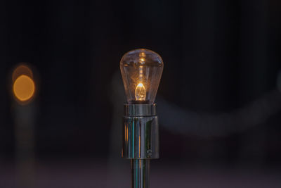 Close-up of illuminated light bulb