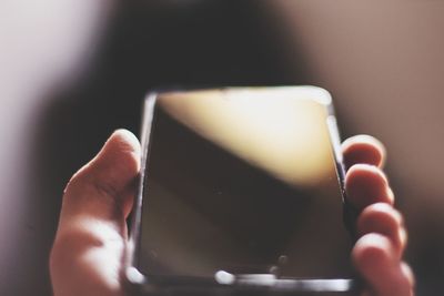 Close-up of person using mobile phone