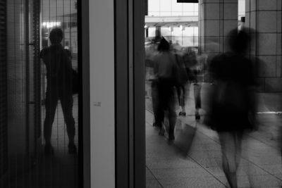 People walking in corridor