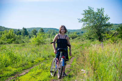 Portrait of a teenage girl riding a bicycle