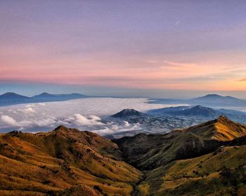 Scenic view of mountains against sky during sunset