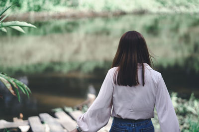 Rear view of woman standing outdoors