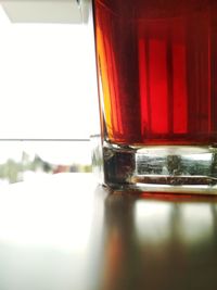 Close-up of red wine in glass on table