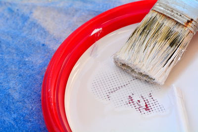 High angle view of red and knife on table