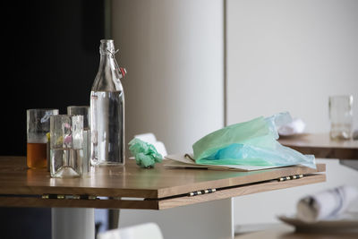 Close-up of empty glass bottle on table