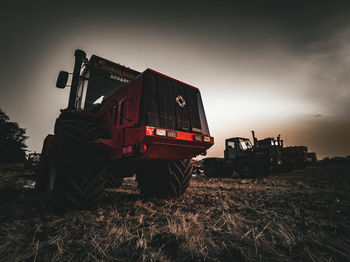 Tractor on agricultural field against sky